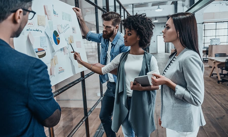 Young-colleagues-collaborating-at-white-board