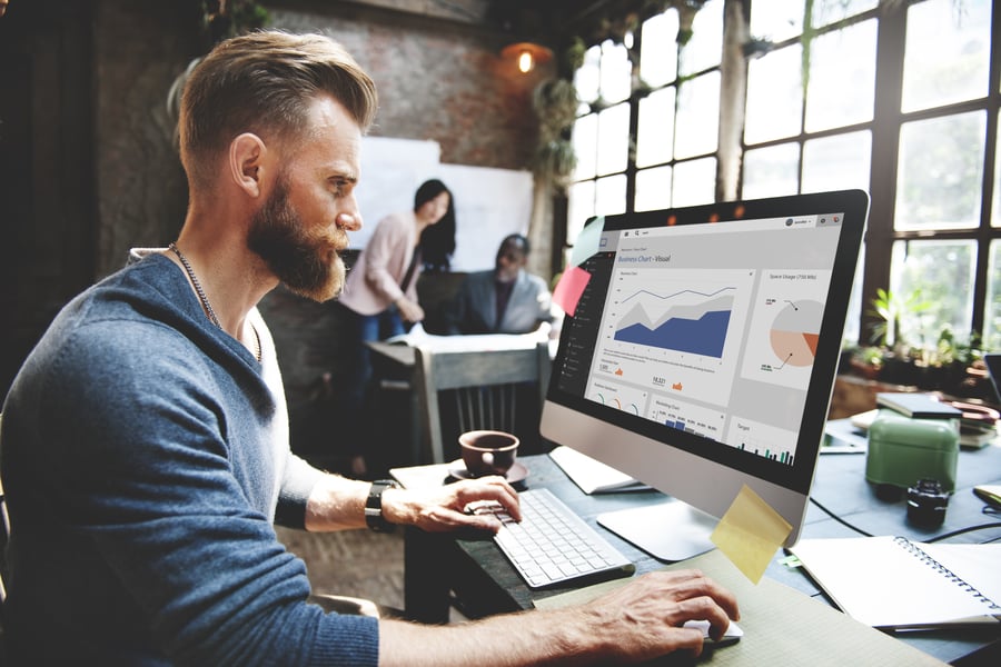 bearded-man-office-computer-data-chart