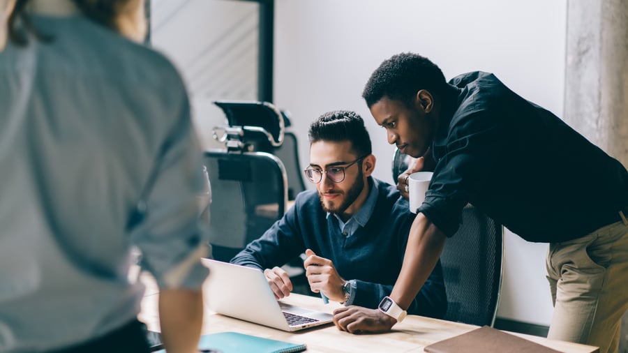 young-marketing-team-looking-at-the-computer