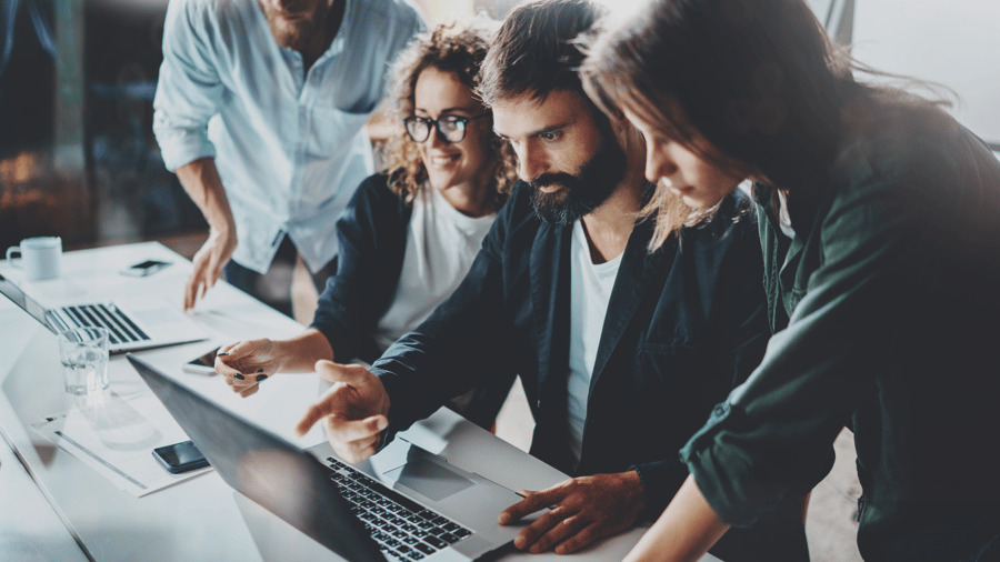 young-marketing-team-collaborating-discussing-at-computer